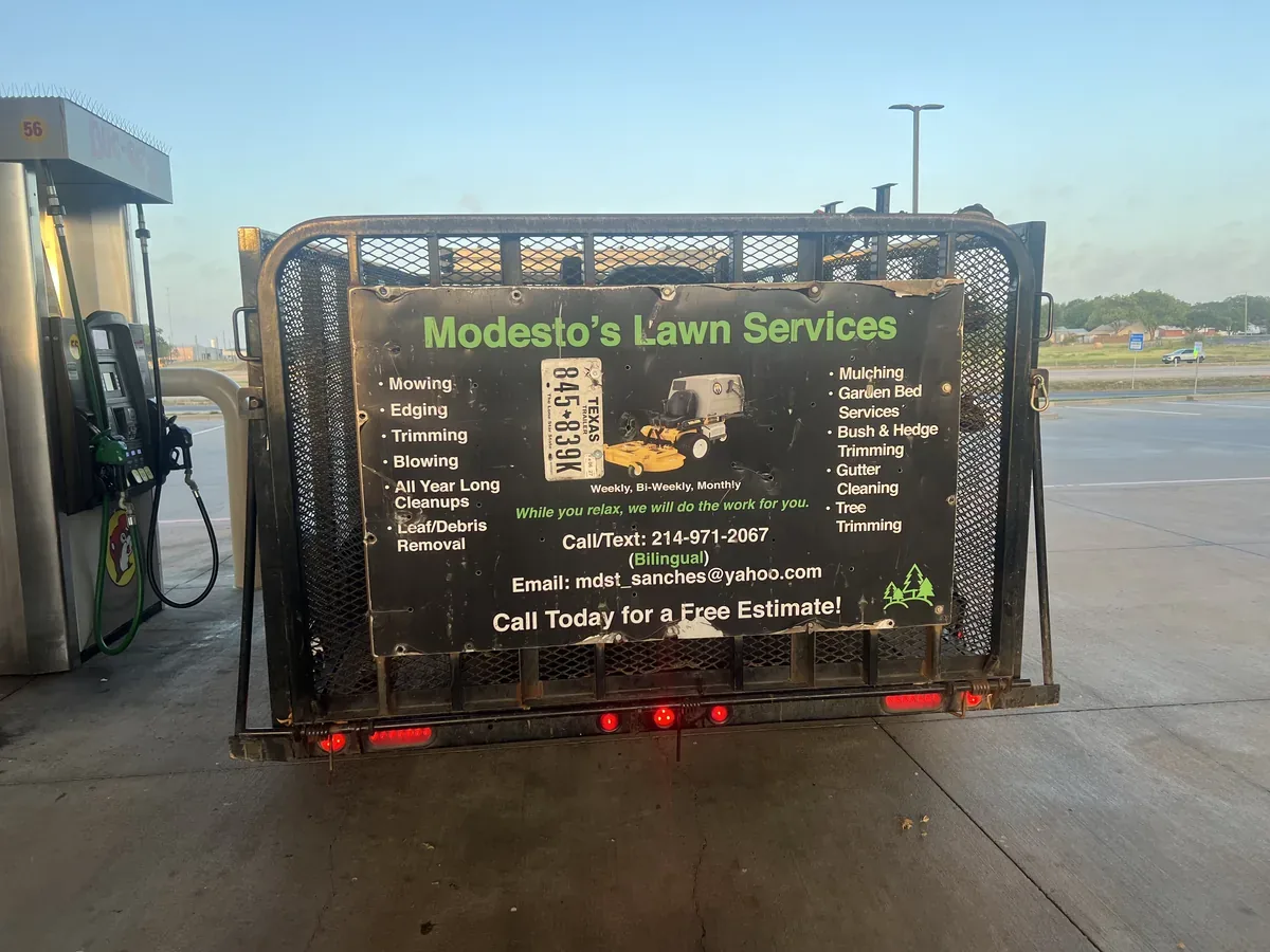Equipment trailer with a service sign board listing available services